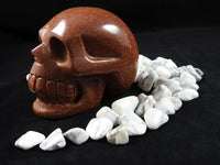 Goldstone Crystal Skull sitting in Howlite