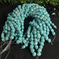 Blue Magnesite Skull Bead Strands